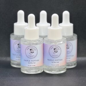 Five glass bottles of facial serum